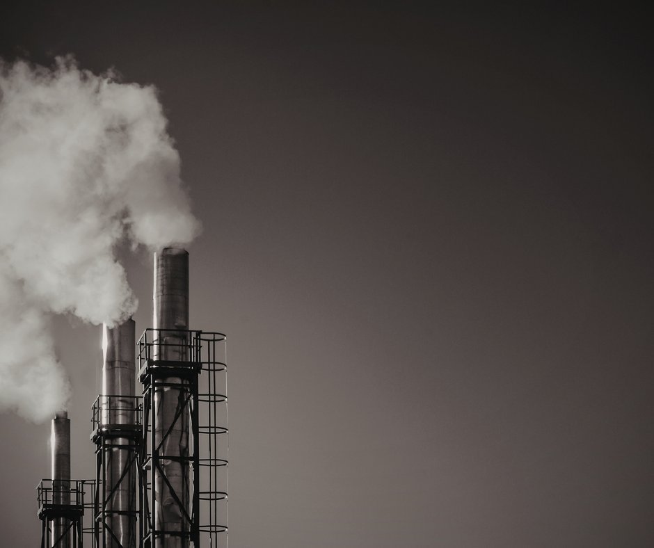 Industrial smokestacks at dusk — CFI Industries services for smelters, manufacturers and industrial plants in Quebec.